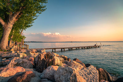 Scenic view of sea against sky during sunset