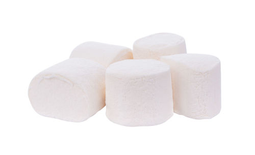 Close-up of marshmallows over white background