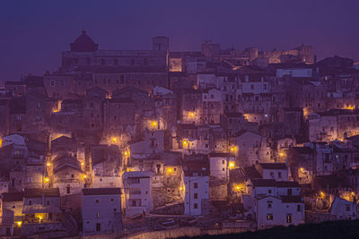 Illuminated buildings in city at night