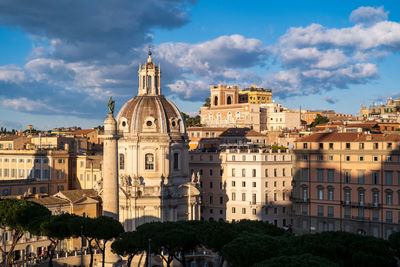 Buildings in city against sky