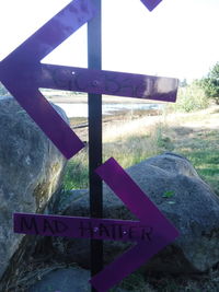 Close-up of signboard on field