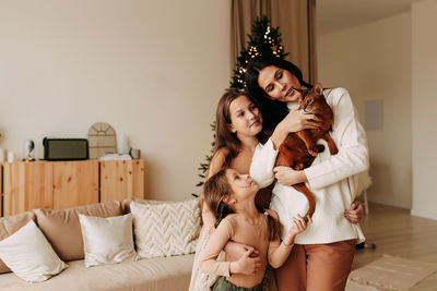 Family lifestyle. mom and kids are preparing for christmas holidays in a decorated house in winter