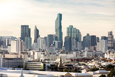 Modern buildings in city against sky