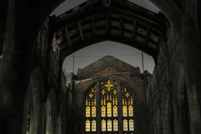 Archway against sky seen through arch