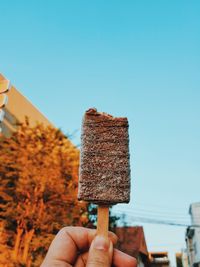 Cropped image of hand holding ice cream cone