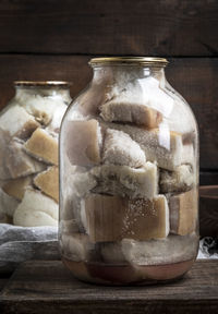 Breads in jar on cutting board