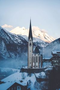 View of church against snowcapped mountain