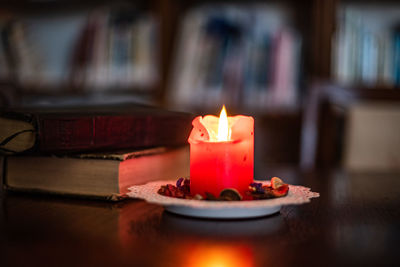 Close-up of tea light candles on table