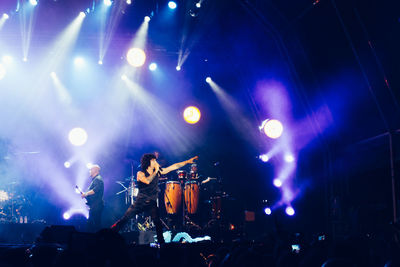 Group of people in concert at night