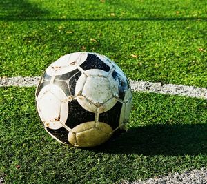 Close-up of soccer ball on field