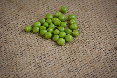 High angle view of green fruits on table