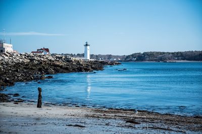 View of lighthouse against clear blue sky