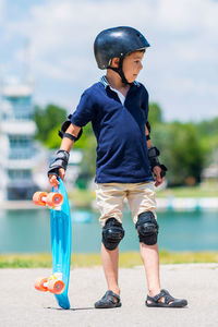 Rear view of boy with arms outstretched