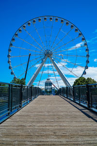 Ferris wheel against blue sky