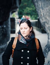 Portrait of woman standing in snow