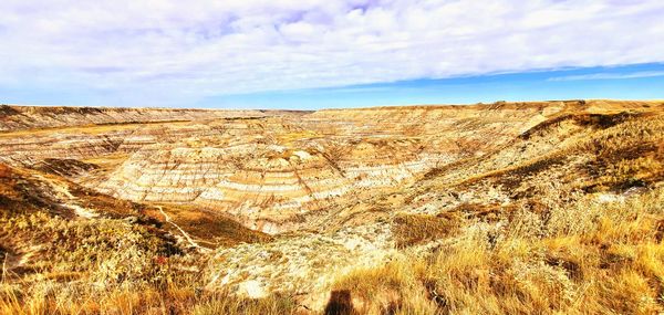 View of arid landscape against sky