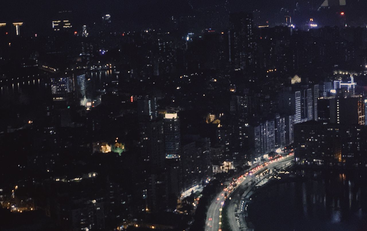 ILLUMINATED CITYSCAPE AT NIGHT