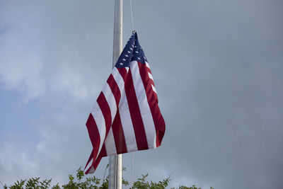 Low angle view of flag against sky