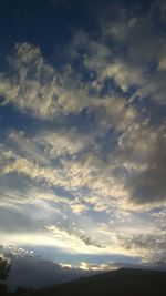 Low angle view of cloudy sky during sunset