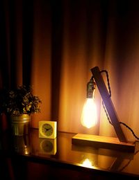 Lit lamp in dark room