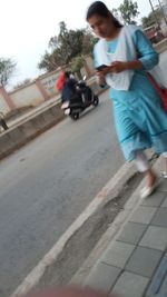 People walking on road in city