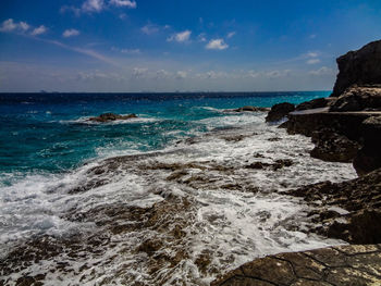 Scenic view of sea against blue sky