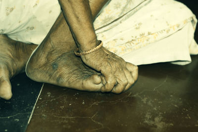 Low section of man sitting