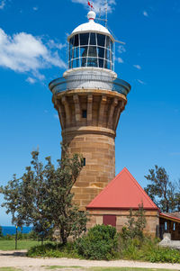 Low angle view of water tower against sky