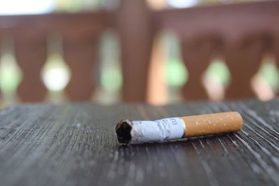 Close-up of cigarette on table