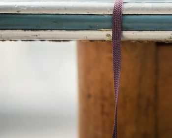 Close-up of strap on railing