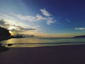 Scenic view of beach against sky during sunset