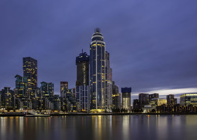 Illuminated buildings in city at night