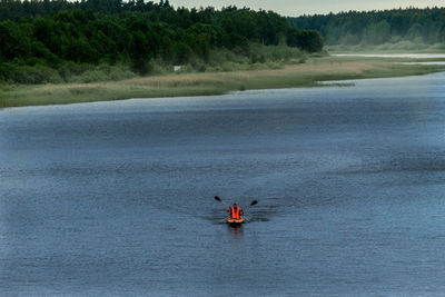 People on boat in river