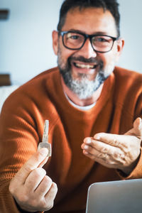 Portrait of young man using mobile phone