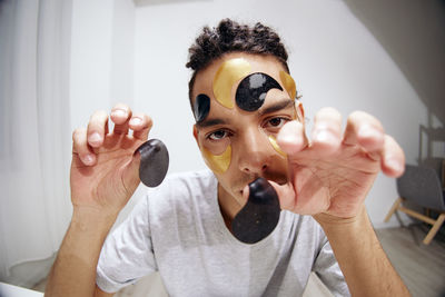 Portrait of young man with face paint