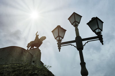 Low angle view of street light against sky