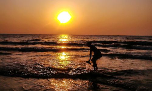 Scenic view of sea at sunset