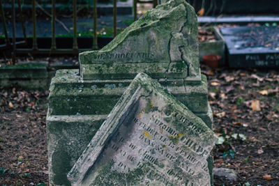 Close-up of text on stone at cemetery