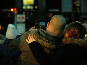 Close-up of man using mobile phone