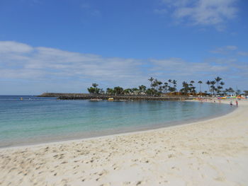 Scenic view of beach against sky