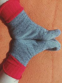 Low section of person wearing canvas shoes