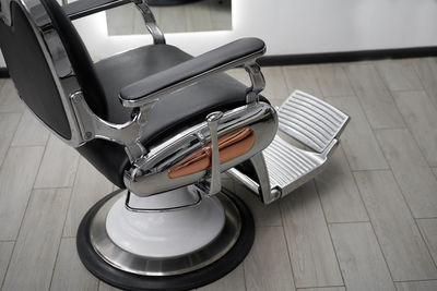 Close-up of chair in barber shop