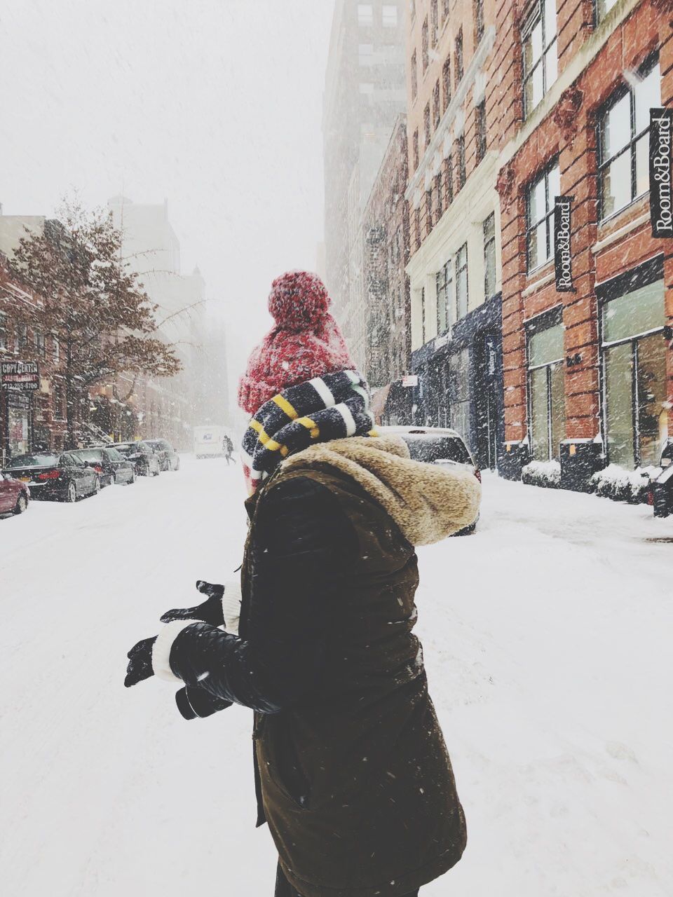 REAR VIEW OF WOMAN IN SNOW DURING WINTER