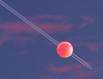 Low angle view of moon against sky at night