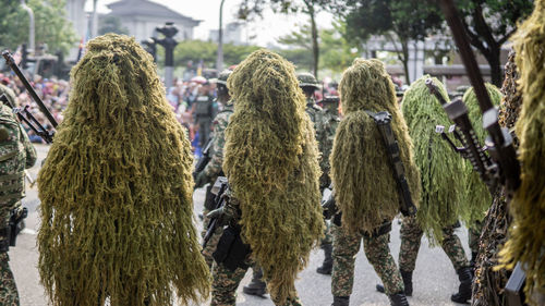 Rear view of people walking outdoors