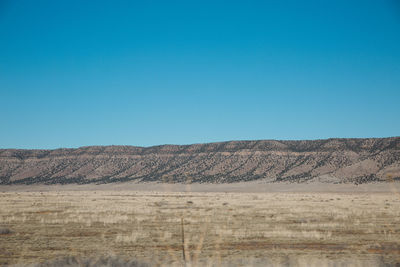 Landscape against clear blue sky