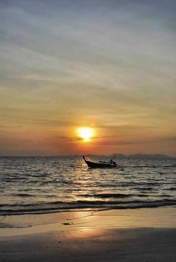 SILHOUETTE BOAT ON BEACH AGAINST SKY DURING SUNSET