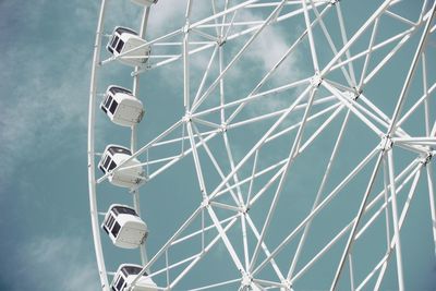 Low angle view of ferris wheel against sky