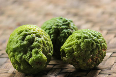 Close-up of green fruits on table