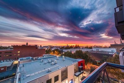High angle view of buildings against sky during sunset